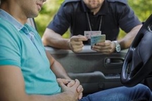 Person pulled over by a cop Person pulled over by a cop