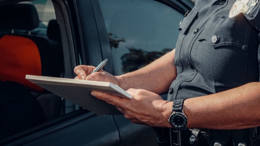 Police officer issuing a speeding ticket