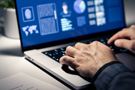 Investigator working on the computer